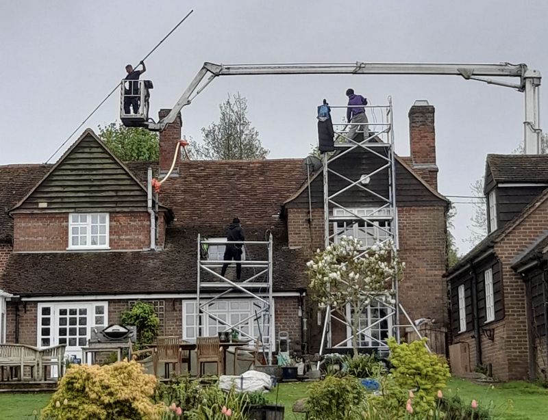 The Moss Cleaners using cherry picker and scaffolding to clean roof safely and professionally in Frampton Cotterell, Gloucestershire